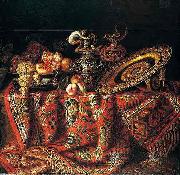 A still life of peaches, grapes and pomegranates in a pewter bowl, an ornate ormolu plate and ewers, all resting on a table draped with a carpet